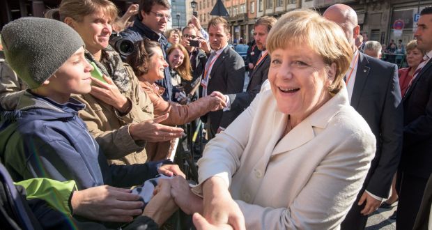 German chancellor Angela Merkel celebrates the 25th anniversary of German reunification. Political critics argue that Germany’s resources are exhausted even before one million refugees arrive this year. Photograph: Thomas Lohnes/Getty