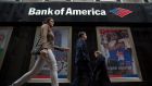 Pedestrians walk past a Bank of America branch in Chicago