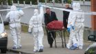 The body of Kieran Farrelly is  removed from the scene  at Killarney Court flats off Buckingham Street, Dublin. Photograph: Gareth Chaney/Collins