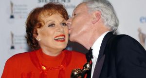 Maureen O’Hara, who has died at the age of 95, being kissed by Gay Byrne after he presented her with her lifetime achievement award at the Irish Film & Television Awards. Photograph: Haydn West/PA Wire