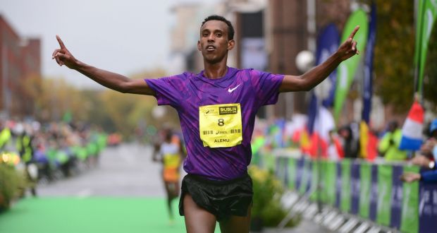  Ethiopia’s Alemu Gemechu crosses the line to win the the  men’s race at the  the SSE Airtricity Dublin Marathon. Photograph: Dara Mac Dónaill/The Irish Times