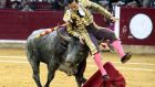 Spanish bullfighter Rafaelillo is tossed by a bull  at La Misericordia bullring in Zaragoza, Spain. Photograph: EPA/Javier Cebollada