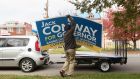 A Democratic Party supporter in Louisville takes down a sign supporting Jack Conway, the defeated candidate in the Kentucky governorship election. Photograph: Philip Scott Andrew/The New York Times