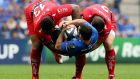 Toulon’s Mathieu Bastareaud and Guilhem Guirado tackle Rob Kearney of Leinster in last year’s European Rugby Champions Cup semi-final. Toulon are second favourites to win their fourth Cup in a row. Photograph: James Crombie/Inpho