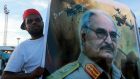 A man holds a picture of General Khalifa Haftar during a demonstration in support of the Libyan army under the leadership of General Khalifa in Benghazi, Libya on November 6th, 2015. Photograph: Esam Omran Al-Fetori/Reuters