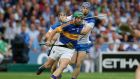 Tipperary’s James Woodlock and Colin Dunford of Waterford in this year’s Munster final. Photograph: Ryan Byrne/Inpho