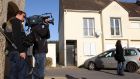 Journalists  in front of the house in Chartres, France, where neighbours say Ismaël Omar Mostefaï, one of the three suspected attackers who killed almost 100 people at the Bataclan music venue in Paris, lived with his family until about two years ago. Photograph: Michel Spingler/AP