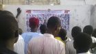 Locals view photographs  of wanted Boko Haram suspects on a notice posted by the Nigerian military in Maiduguri, Borno State, Nigeria, on November 13th.  Photograph: Reuters