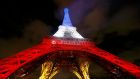 Fluctuat Nec Mergitur: Paris’s motto – Latin for Tossed But Not Sunk – on the Eiffel Tower. Photograph: Reuters