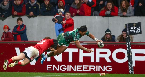 Connacht’s Bundee Aki scores his side’s second try despite Andrew Conway of Munster Photograph: James Crombie/Inpho