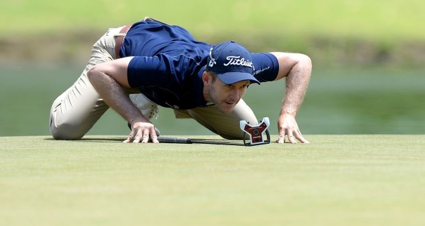 Stuart Manley of Wales lines up a putt on the sixth hole during day three of the  Australian PGA Championship at Royal Pines Resort. Photo: Bradley Kanaris/Getty Images