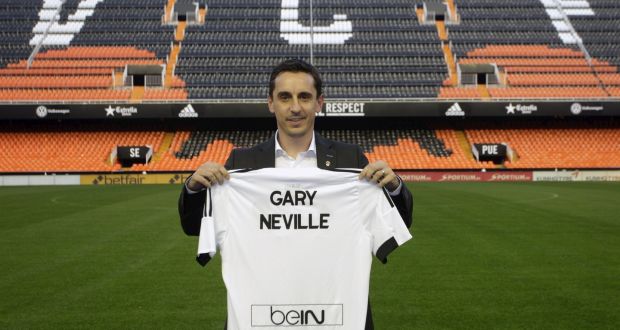 Valencia’s new coach Gary Neville poses with his jersey during his presentation at the Mestalla Stadium last week: the former Manchester United defender is the eighth member of United’s 1996-97 squad to be appointed as a head coach. Photograph: Heino Kalis/Reuters