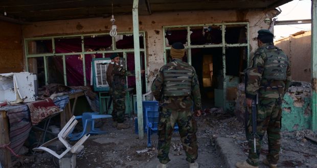 Afghan national army soldiers inspect buildings at Kandahar airport on Wednesday after clashes between security forces and Taliban insurgents. Photograph:  Jawed Tanveer/AFP/Getty Images