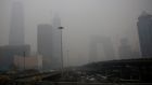 Buildings in Beijing, China, shrouded in smog: China faces a huge air quality crisis, brought on largely by coal-burning, which makes it far more willing to wean itself from the worst form of fossil fuel consumption. Photograph: How Hwee Young/EPA