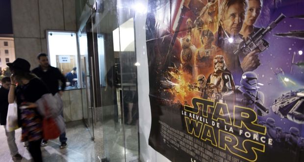 “Star Wars” fans wait outside the cinema prior to the premier screening of the latest “Star Wars: The Force Awakens” film in the Algerian capital, Algiers, on December 20, 2015. Globally, the latest “Star Wars” space epic raked in an estimated $517 million, Disney said, breaking records for biggest opening weekend abroad in 18 other countries, including Russia and Germany, and second biggest across four nations. (Photograph: FAROUK BATICHEFAROUK BATICHE/AFP/Getty Images)