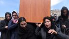 Independent Afghan civil society activist women carry the coffin of Farkhunda. Photograph: Wakil Kohsar/AFP/Getty Images