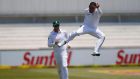  South African bowler Dane Piedt celebrates dismissing England captain Alastair Cook during day three of the first Test match  at Kingsmead Stadium in Durban. Photograph: Marco Longari/AFP/Getty Images