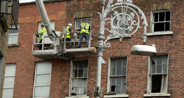 A building on North Great Frederick Street in Dublin is treated by workers. Photograph: Cyril Byrne 