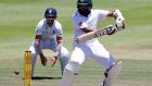 South Africa’s Hashim Amla  plays a shot as England’s James Taylor looks on during the second Test match in Cape Town, South Africa. Photograph: Mike Hutchings/Reuters 