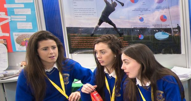 Maire O’Leary, Kelly Walsh and Shannen Murphy from Coláiste Iósaef in Limerick with their project on “Should the GAA go professional?” Photograph: Dara Mac Donaill