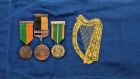 The medals of former president of Ireland Seán T O’Kelly against the pennant carried on the president’s car. Photograph: Spink
