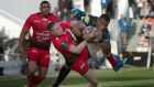 RC Toulon’s Australian fullback James OConnor  vies with Bath’s Fijian wing Semesa Rokoduguni  during the European Champions Cup rugby union match at the Mayol stadium in Toulon, France. Photograph: Getty Images  