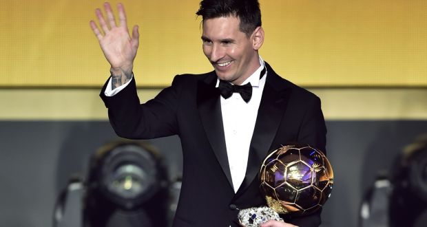   Lionel Messi waves holding his trophy after receiving the 2015 Fifa Ballon d’Or award  at the Kongresshaus in Zurich. Photograph: Fabrice Coffrini/AFP/Getty Images