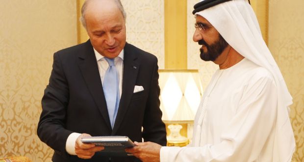 UAE vice president and prime minister, Sheikh Mohammed bin Rashid al-Maktoum with French foreign minister Laurent Fabius during their meeting at his palace in Dubai on Monday. Photograph: Karim Sahib/Getty Images