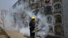 Fumigating to prevent dengue, chikunguya and Zika virus at El Angel cemetery, in Lima, Peru. Photograph: Martin Mejia/AP Photo