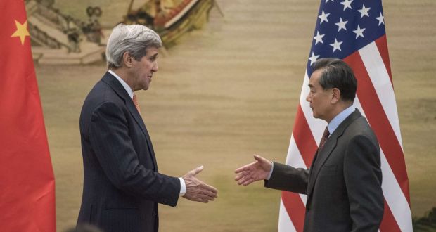 Chinese foreign minister Wang Yi (right) prepares to shake hands with US secretary of state John Kerry  at the Ministry of Foreign Affairs in Beijing,  January 27th, 2016. Photograph: Fred Dufour/AFP/Getty Images