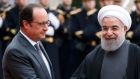 French president François Hollande  welcomes Iran’s president Hassan Rouhani as he arrives at the Élysée Palace in Paris.  Photograph: Charles Platiau/Reuters