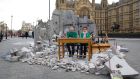 Two children whose school was bombed in Aleppo pose in a mock-up meant to symbolise a destroyed classroom set up by charity Save the Children outside the Houses of Parliament in London on Wednesday on  eve of a donor conference aiming to raise money for the millions of Syrians hit by the country’s civil war and a refugee crisis. Photograph: AFP/Getty Images
