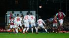 West Ham’s Angelo Ogbonna rises above the Liverpool defence to head home the winning goal in the FA Cup fourth-round replay in extra-time at Upton Park. Photograph:  Eddie Keogh/Reuters/Livepic