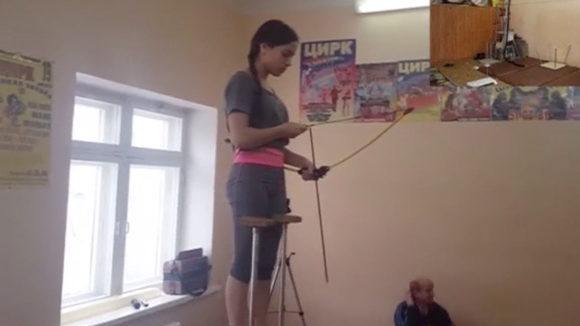 Russian Teen Shoots Bow And Arrow With Feet While Standing On Her Hands
