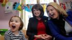  Labour Party leader Joan Burton (centre) and Senator Lorraine Higgins (right) meet three-year-old Clodagh Ward at the Rainbow Crèche, Athenry during her campaign tour in Coy Galway last week. Photograph:  Hany Marzouk