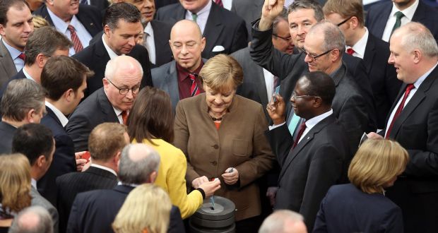 German chancellor Angela Merkel and other members of parliament vote on the introduction of expedited asylum proceedings in the German Bundestag on Thursday. Photograph: Wolfgang Kumm/EPA