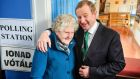 Taoiseach Enda Kenny  with local resident Bridie McLaughlin after he cast his vote in Castlebar.  Photograph: Bloomberg