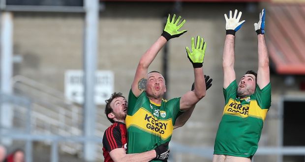Kerry’s Kieran Donaghy and Bryan Sheehan display their high-fielding skills during their Football League Division One game against Down at Páirc Esler, Newry, on Sunday. Photograph: Matt Mackey/Inpho.