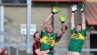 Kerry’s Kieran Donaghy and Bryan Sheehan display their high-fielding skills during their Football League Division One game against Down at Páirc Esler, Newry, on Sunday. Photograph: Matt Mackey/Inpho.