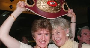 Deirdre Gogarty is welcomed by her mother Mrs Edie Gogarty after returning home to Ireland with her world title belt.  Pic Paddy Whelan