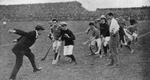  Michael Collins  throwing in the sliotar  to start a hurling game at Croke Park in 1921.  Photograph: Hogan/Hulton Archive/Getty Images