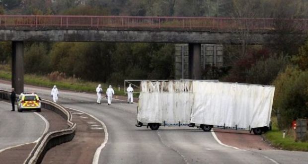 Forensic officers search the scene on the M1 motorway where prison officer David Black was shot as he drove near the town of Lurgan, Northern Ireland on November 1st, 2012. Photograph: Reuters