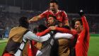 Benfica’s players celebrate during the Champions League round of 16  second-leg match against Zenit St Petersburg   at the Petrovsky stadium. Photograph: Olga Maltseva/AFP/Getty Images