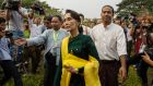 Aung San Suu Kyi attends a meeting at the Sibin Guesthouse, where many of the NLD members of parliament live. Photograph: Lauren DeCicca/Getty Images