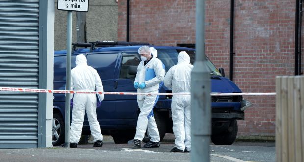 PSNI forensic officers inspect the damaged van following a suspected car bomb attack on a prison officer  in Belfast. Photograph: Charles McQuillan/Getty Images