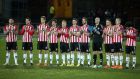 Derry City players pay tribute to former striker Mark Farren before the game. Photo: Lorcan Doherty/Inpho