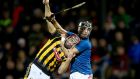 Kevin Kelly of Kilkenny is held by  Killian Burke of Cork during the Allianz Hurling League Division 1A game at Páirc U Rínn. Photograph: Donall Farmer