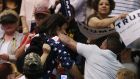 Trump protester Bryan Sanders, centre left, is punched by a Trump supporter as he is escorted out of Republican presidential candidate Donald Trump’s rally at the Tucson Arena in downtown Tucson, Arizona on Saturday. Photograph: AP  
