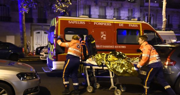 An injured person is rescued  close to Paris’s Bataclan concert hall on the night of November 13th, 2015: the attackers, sent by the Islamic State’s external operations wing, were well-versed in a range of terrorism tactics such as suicide vests, gunmen in various locations and hostage-taking a report shows. Photograph: Miguel Medinamiguel Medina/AFP/Getty