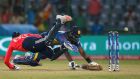 Sri Lanka captain Angelo Mathews  dives successfully to make his ground  as England wicketkeeper Jos Buttler tries to run him out. Photograph: Adnan Abidi/Reuters